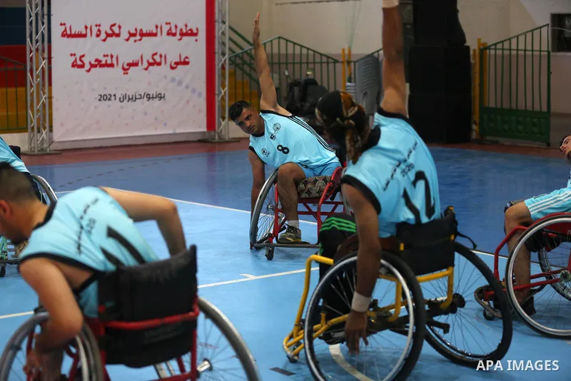 Disabled Palestinian men on wheelchairs participate in Super Wheelchair Basketball League in Gaza city, on June 29, 2021. The Super League wheelchair basketball matches are back after a year and a half break due to the C...