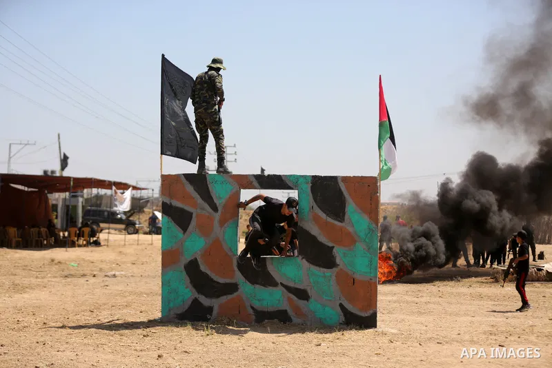 Young Palestinians attend a military summer camp organised by the Islamic Jihad Movement, in Gaza City, June 28, 2021. Photo by Dawoud Abu alkas