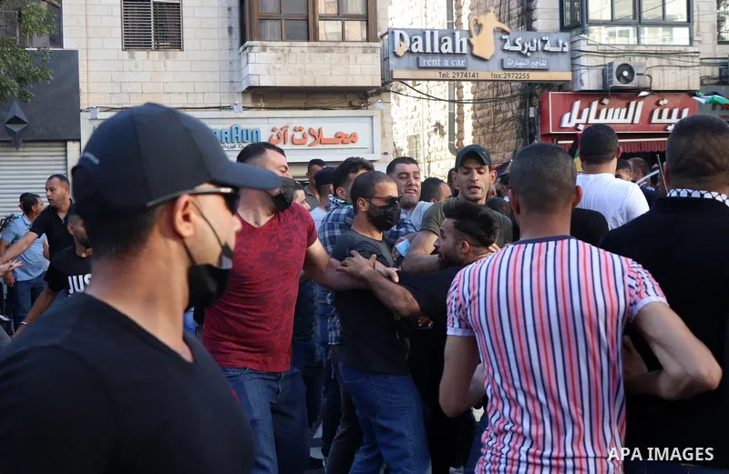 Palestinians take part during a protest aganist the death of human rights activist Nizar Banat in the West Bank city of Ramallah, on June 27, 2021. Photo by Ibrahim atta