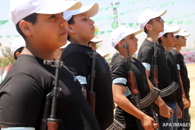 Young Palestinians take part in a military-style exercise a Hamas-run summer camp at the Yarmouk military site, in Gaza city, on July 26, 2021. Photo by Naaman Omar