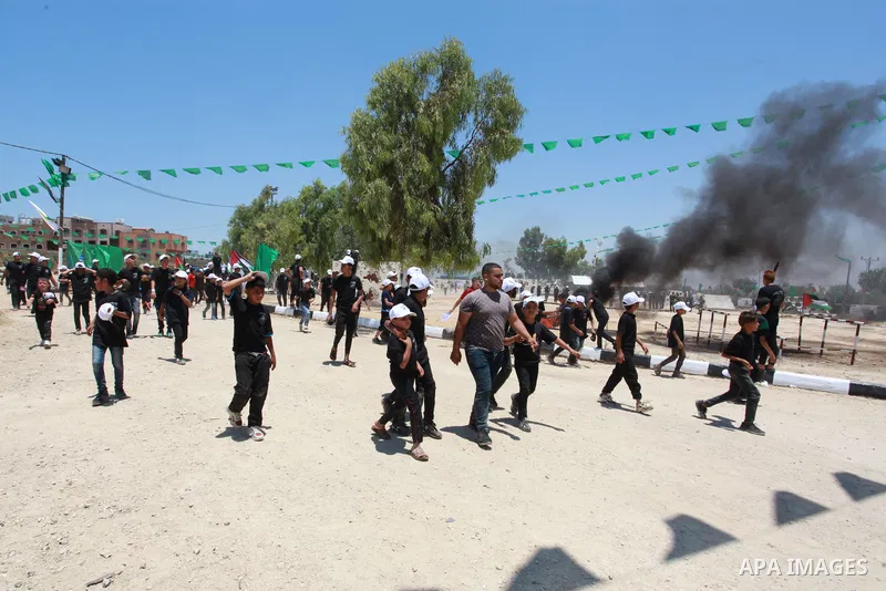 Young Palestinians take part in a military-style exercise a Hamas-run summer camp at the Yarmouk military site, in Gaza city, on July 26, 2021. Photo by Naaman Omar