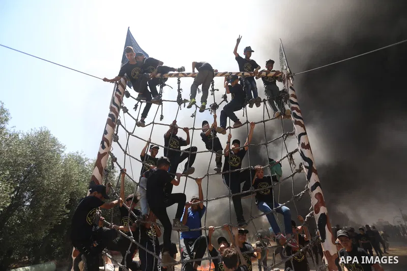Young Palestinians attend a military summer camp organised by the Islamic Jihad Movement, in Gaza City, June 26, 2021. Photo by Ashraf Amra