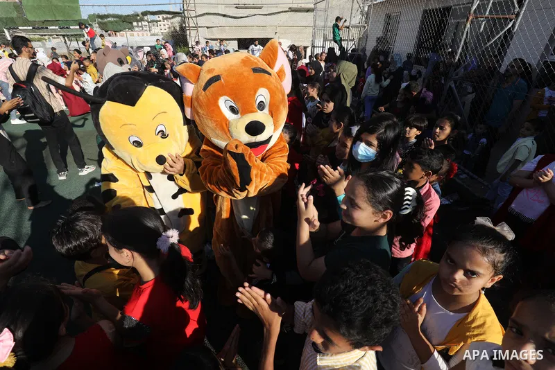 Palestinian children participate in a mental health support session during entertainment festival after the latest Israeli escalation, in Rafah in the southern Gaza Strip, on June 25, 2021. Photo by Abed Deeb
