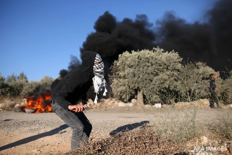 Palestinian protesters take part in a demonstration against the newly built Israeli settlers' outpost of Eviatar in the town of Beita, near the occupied West Bank city of Nablus, on June 24, 2021. Photo by Shadi Jarar'ah