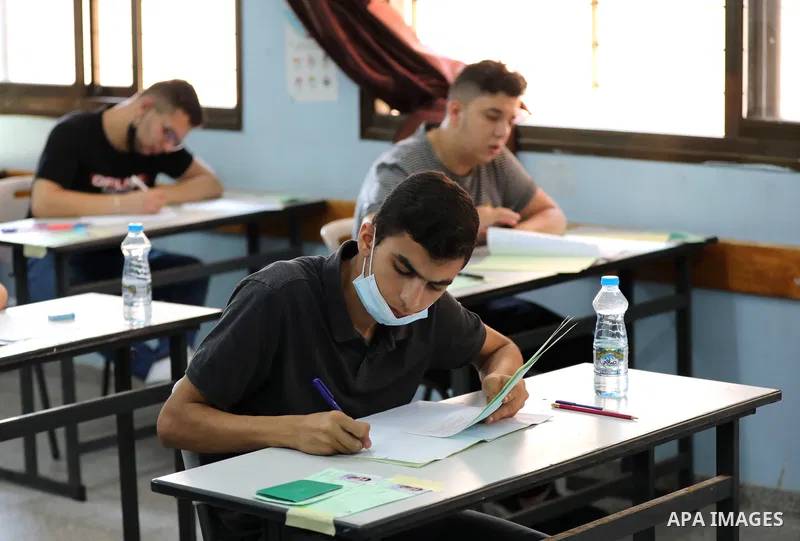 Palestinian students sit for their final high school exams, known as "Tawjihi" in Gaza city on June 24, 2021, amid concerns about the spread of the novel coronavirus pandemic. More than 84598 students in the West Bank an...