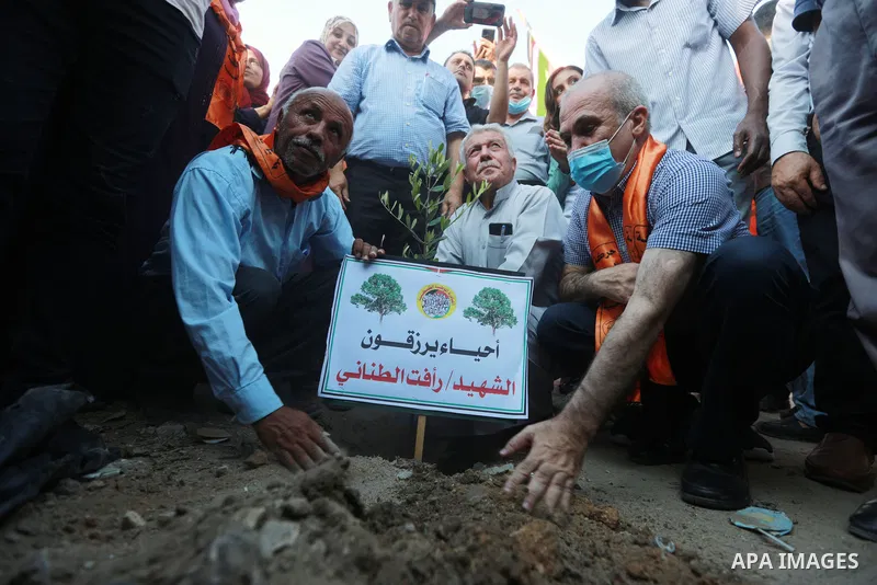 Members of Palestinian National Initiative political party take part in a protest to demand the speedy reconstruction of the houses that were destroyed during the recent Israeli military escalation, in Beit Lahia in the...