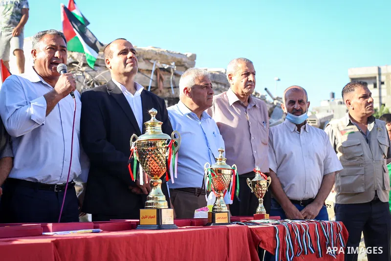 Palestinians attend Marathon in cross-country on the occasion of World Refugee Day, in Jabalia in the northern Gaza Strip on June 22, 2021. Photo by Ismael abu Dayyah