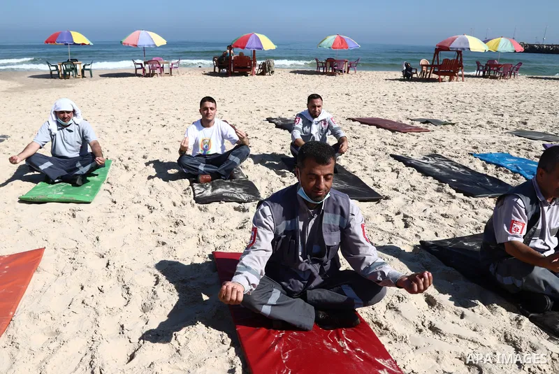 Palestinian paramedics perform yoga on International Day of Yoga, on a beach in Gaza City June 21, 2021. Recognizing this important role of Yoga, this year’s commemoration of the International Day of Yoga focuses on “Yog...