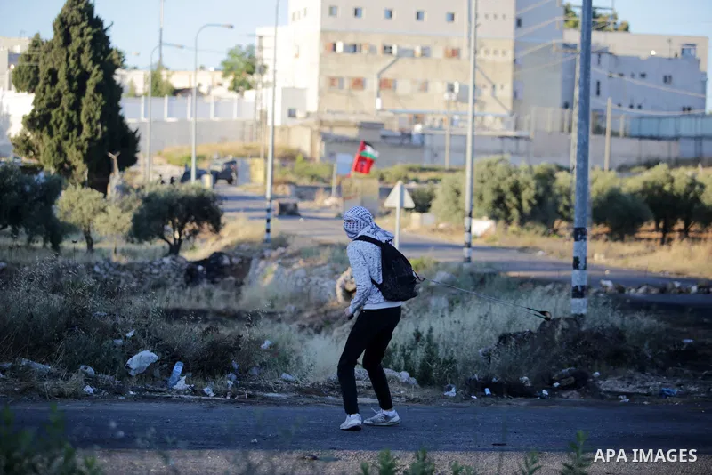 Palestinian protesters clash with Israeli security forces during a demonstration near the Jewish settlement of Beit El near Ramallah, in the West Bank, on June 15, 2021, protesting the Israeli ultranationalist March of t...