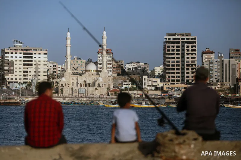 Fishermen's boats anchor in the Gaza port, on June 11, 2021. The beach is one of the few open public spaces in this densely populated city. Photo by Mohammed Dahman