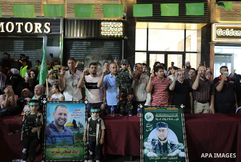 Palestinian supporters of Hamas movement take part in an anti-Israel rally in Gaza city, on June 9, 2021. The Egyptian-brokered truce ended 11 days of heavy Israeli bombing of Gaza and rocket fire from the impoverished c...