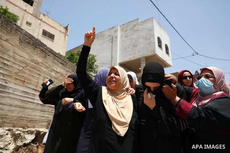 Relatives react during the funeral of Palestinian security man Tayseer Issa, who was killed by Israeli forces according to health ministry in the Werst bank city of Jenin, on June 10, 2021. Photo by Oday Daibes