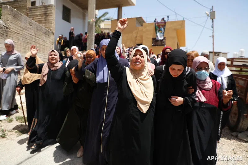 Relatives react during the funeral of Palestinian security man Tayseer Issa, who was killed by Israeli forces according to health ministry in the Werst bank city of Jenin, on June 10, 2021. Photo by Oday Daibes