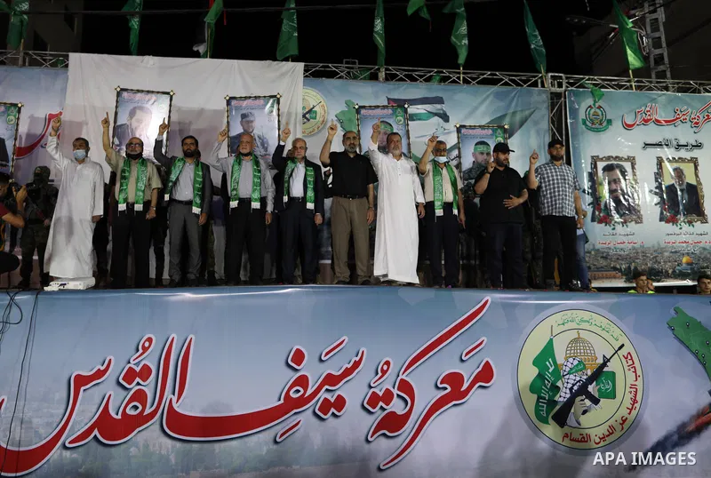 Palestinian supporters of Hamas movement take part in an anti-Israel rally in Gaza city, on June 9, 2021. The Egyptian-brokered truce ended 11 days of heavy Israeli bombing of Gaza and rocket fire from the impoverished c...