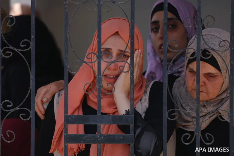 Relatives react during the funeral of Palestinian security man Tayseer Issa, who was killed by Israeli forces according to health ministry in the Werst bank city of Jenin, on June 10, 2021. Photo by Oday Daibes