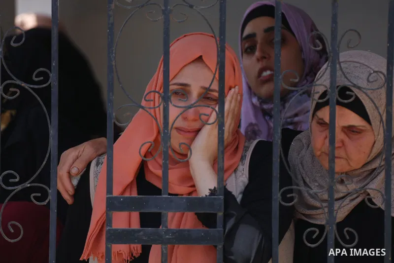 Relatives react during the funeral of Palestinian security man Tayseer Issa, who was killed by Israeli forces according to health ministry in the Werst bank city of Jenin, on June 10, 2021. Photo by Oday Daibes