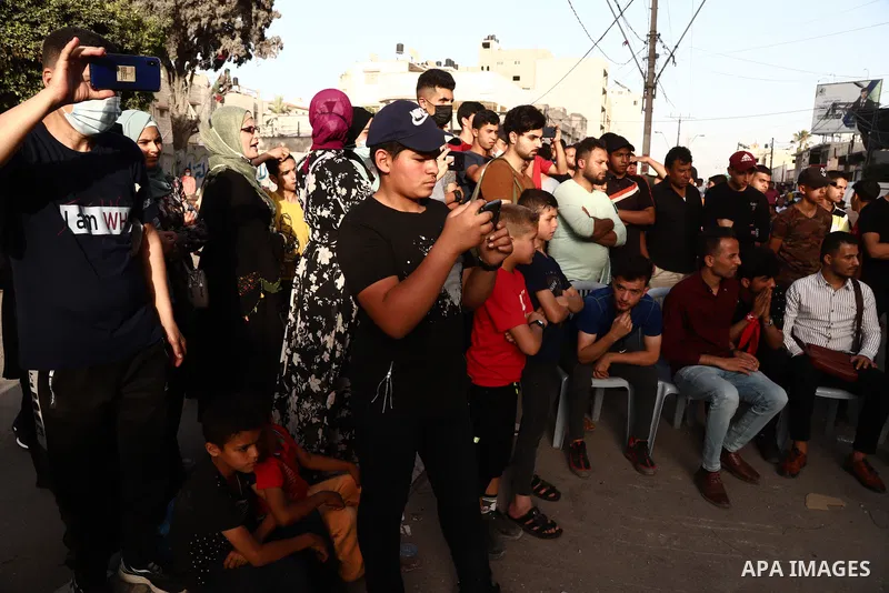Palestinian Dabka band perform during an event "With blood, we write for Palestine" near the rubble of Shorouq tower destroyed by Israeli air strikes last month, in Gaza city on June 9, 2021. The Egyptian-brokered truce...