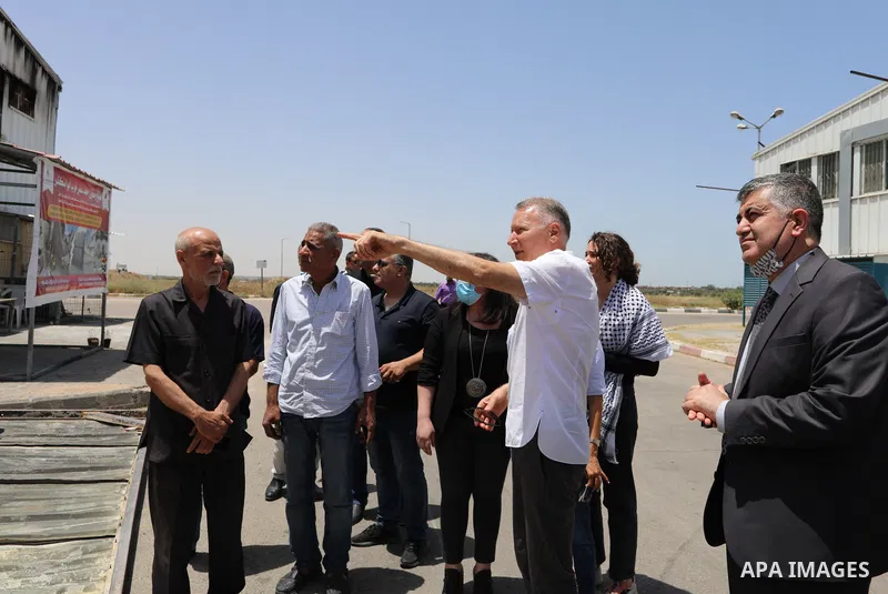 Palestinian businessman and Head of the Board of Directors of "PADICO Holding", Bashar Al-Masry, visits the factories damaged in Gaza's industrial area, which was hit by Israeli strikes, in Gaza city on June 09, 2021. Ga...