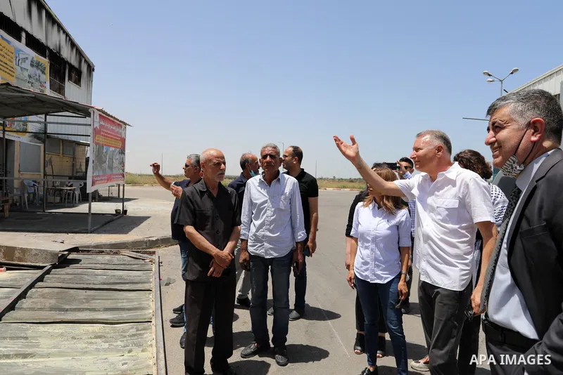 Palestinian businessman and Head of the Board of Directors of "PADICO Holding", Bashar Al-Masry, visits the factories damaged in Gaza's industrial area, which was hit by Israeli strikes, in Gaza city on June 09, 2021. Ga...