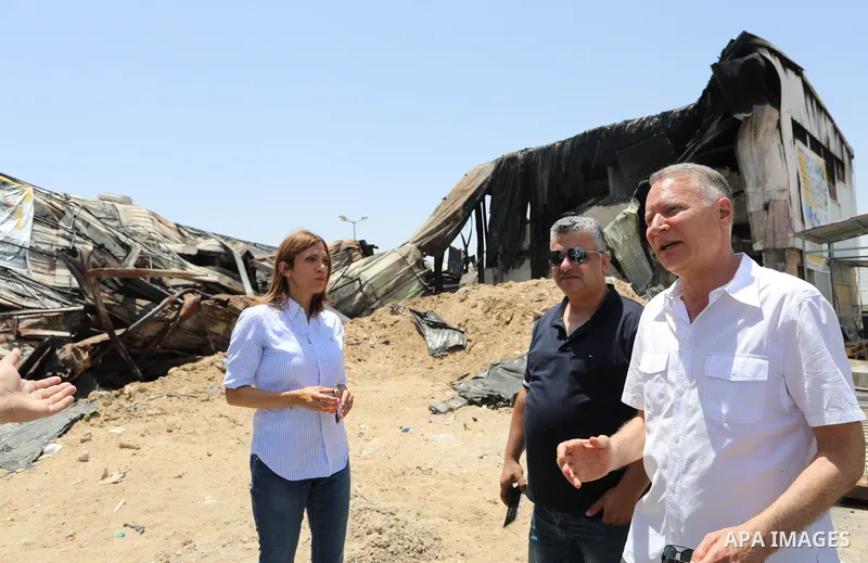 Palestinian businessman and Head of the Board of Directors of "PADICO Holding", Bashar Al-Masry, visits the factories damaged in Gaza's industrial area, which was hit by Israeli strikes, in Gaza city on June 09, 2021. Ga...