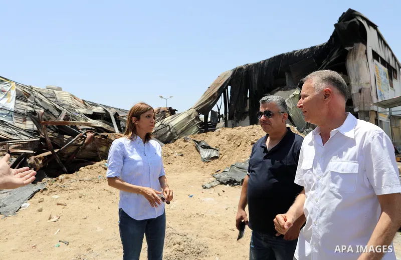 Palestinian businessman and Head of the Board of Directors of "PADICO Holding", Bashar Al-Masry, visits the factories damaged in Gaza's industrial area, which was hit by Israeli strikes, in Gaza city on June 09, 2021. Ga...