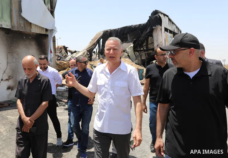 Palestinian businessman and Head of the Board of Directors of "PADICO Holding", Bashar Al-Masry, visits the factories damaged in Gaza's industrial area, which was hit by Israeli strikes, in Gaza city on June 09, 2021. Ga...