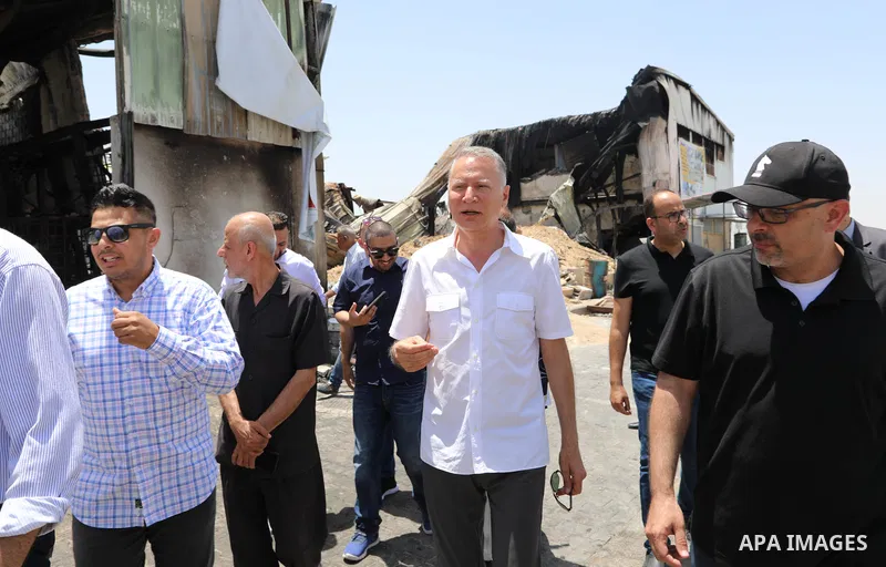 Palestinian businessman and Head of the Board of Directors of "PADICO Holding", Bashar Al-Masry, visits the factories damaged in Gaza's industrial area, which was hit by Israeli strikes, in Gaza city on June 09, 2021. Ga...