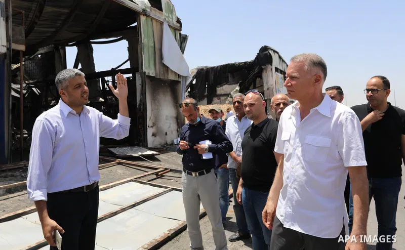 Palestinian businessman and Head of the Board of Directors of "PADICO Holding", Bashar Al-Masry, visits the factories damaged in Gaza's industrial area, which was hit by Israeli strikes, in Gaza city on June 09, 2021. Ga...