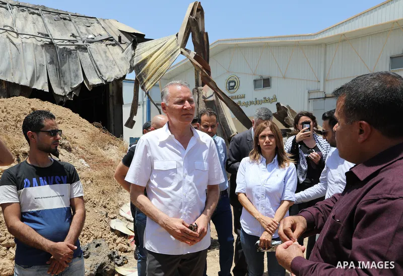Palestinian businessman and Head of the Board of Directors of "PADICO Holding", Bashar Al-Masry, visits the factories damaged in Gaza's industrial area, which was hit by Israeli strikes, in Gaza city on June 09, 2021. Ga...