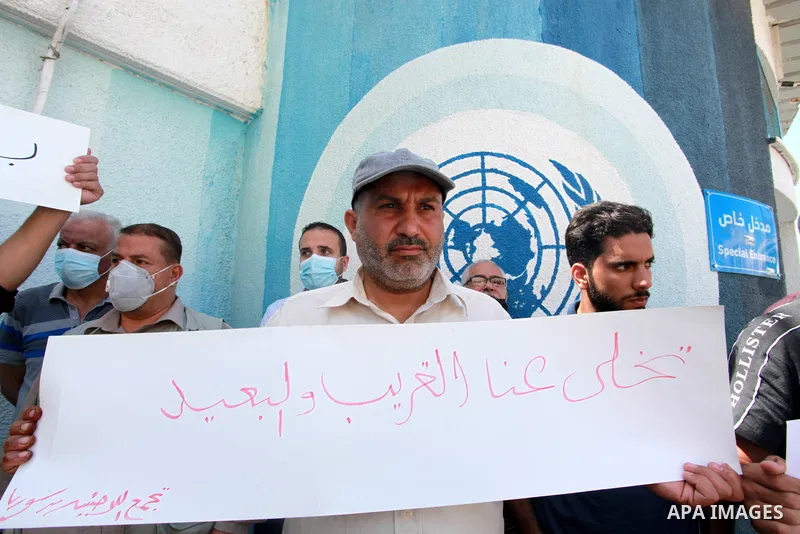 Palestinian refugees from Syria take part in a protest to demand their rights in front of the headquarters United Nations Relief and Works Agency (UNRWA), in Gaza City on June 9, 2021.There are currently 54 families with...