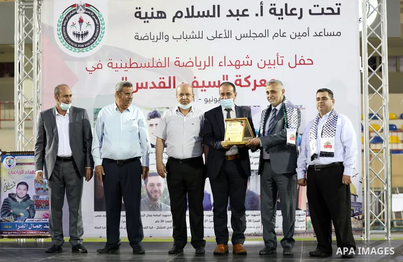 Palestinians attend a honor ceremony for athletes who killed by Israeli airstrikes during the latest Israeli military escalation last month, in Gaza city on June 8, 2021. Israeli air strikes and artillery fire on Gaza ki...