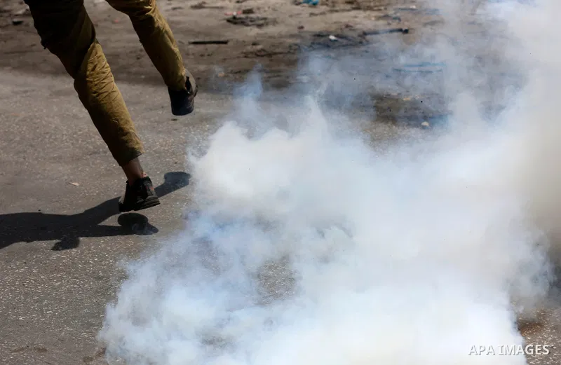 Palestinian youths clash with Israeli security forces against Israeli settlements in the village of Beita, south of Nablus, in the occupied West Bank on June 8, 2021. Photo by Shadi Jarar'ah