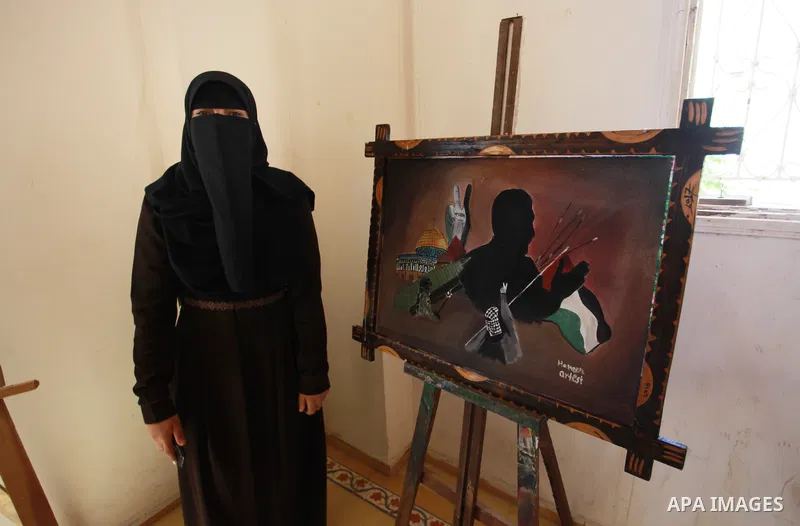 Palestinians attend an exhibition entitled "dirt and stones" at the Arts and Crafts Village in Gaza City, on June 8, 2021. Gaza’s housing ministry said on Thursday that 16,800 housing units had been damaged. Of those, 1,...