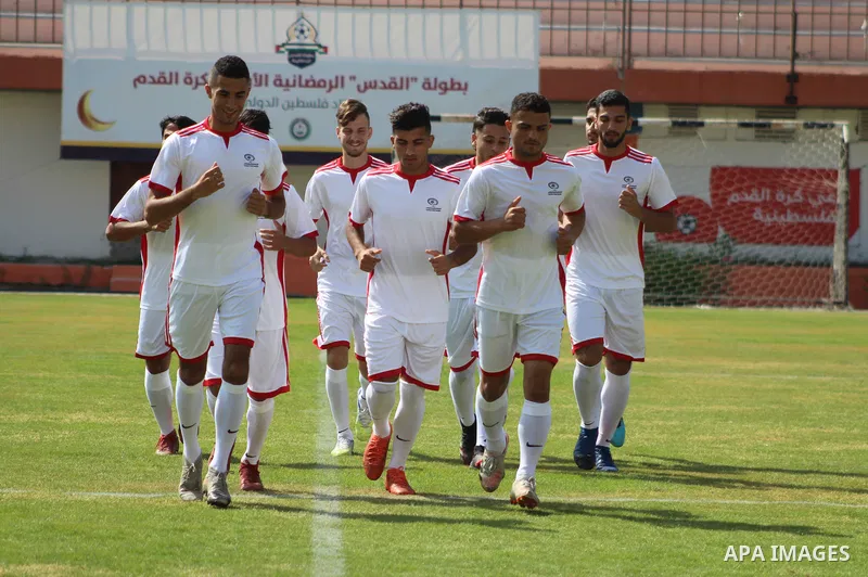 Palestinian Olympic Team Players, take part in training exercises in a Palestine stadium in Gaza City on June 8, 2021. Palestine first competed at the Summer Olympics, in 1996. The Palestinian National Authority is repre...
