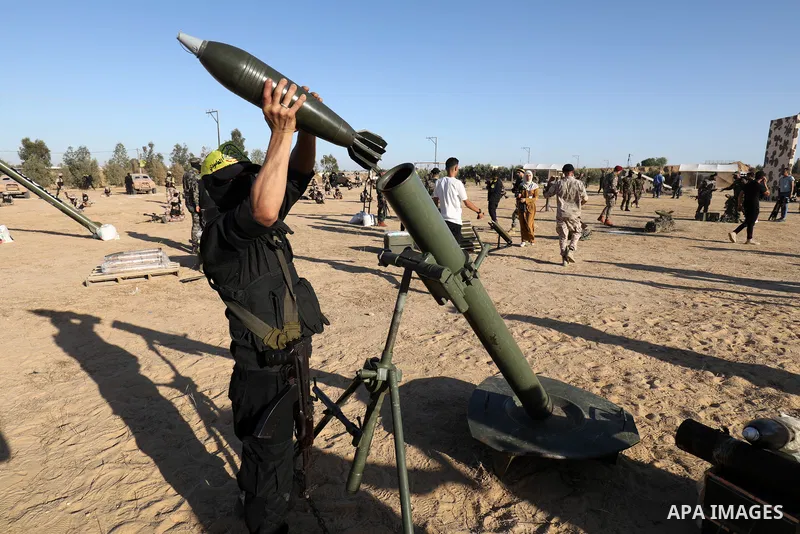 Palestinian militants of Al-Aqsa Martyrs' Brigades, the armed wing of Fatah movement take part in a military parade in an anti-Israel rally, in Khan Younis in the southern of Gaza Strip June 7, 2021. Photo by Abed Deeb
