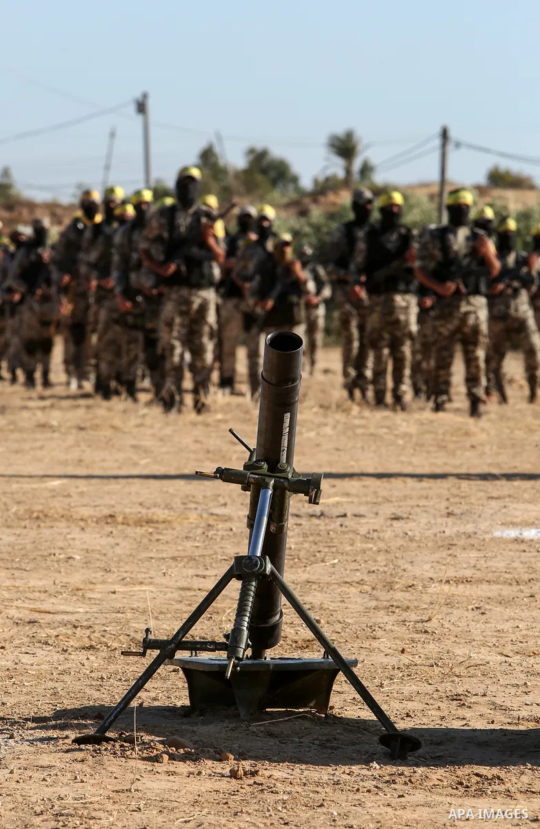 Palestinian militants of Al-Aqsa Martyrs' Brigades, the armed wing of Fatah movement take part in a military parade in an anti-Israel rally, in Khan Younis in the southern of Gaza Strip June 7, 2021. Photo by Abed Deeb