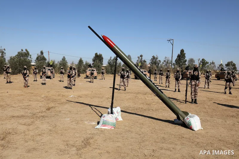 Palestinian militants of Al-Aqsa Martyrs' Brigades, the armed wing of Fatah movement take part in a military parade in an anti-Israel rally, in Khan Younis in the southern of Gaza Strip June 7, 2021. Photo by Abed Deeb
