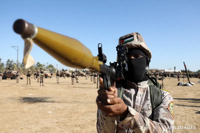 Palestinian militants of Al-Aqsa Martyrs' Brigades, the armed wing of Fatah movement take part in a military parade in an anti-Israel rally, in Khan Younis in the southern of Gaza Strip June 7, 2021. Photo by Abed Deeb