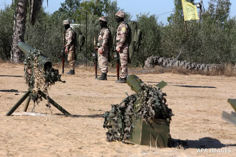Palestinian militants of Al-Aqsa Martyrs' Brigades, the armed wing of Fatah movement take part in a military parade in an anti-Israel rally, in Khan Younis in the southern of Gaza Strip June 7, 2021. Photo by Abed Deeb