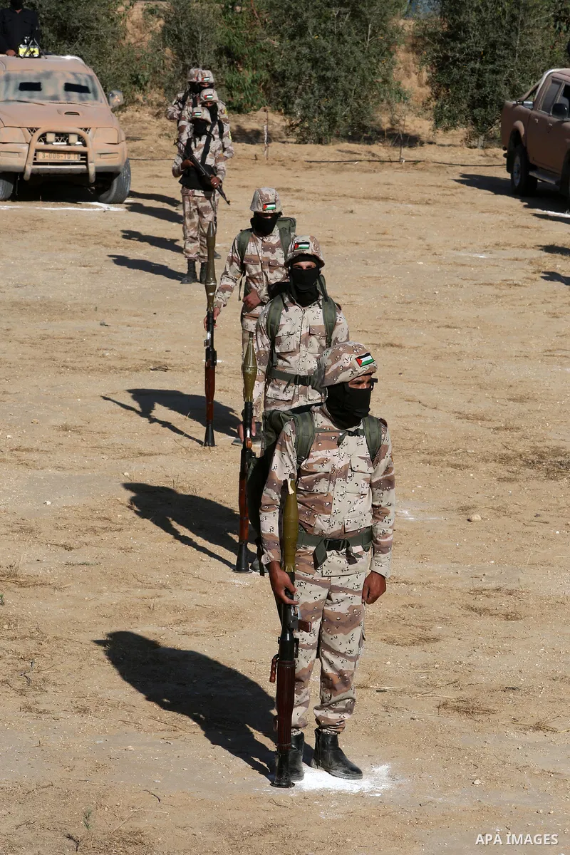 Palestinian militants of Al-Aqsa Martyrs' Brigades, the armed wing of Fatah movement take part in a military parade in an anti-Israel rally, in Khan Younis in the southern of Gaza Strip June 7, 2021. Photo by Abed Deeb