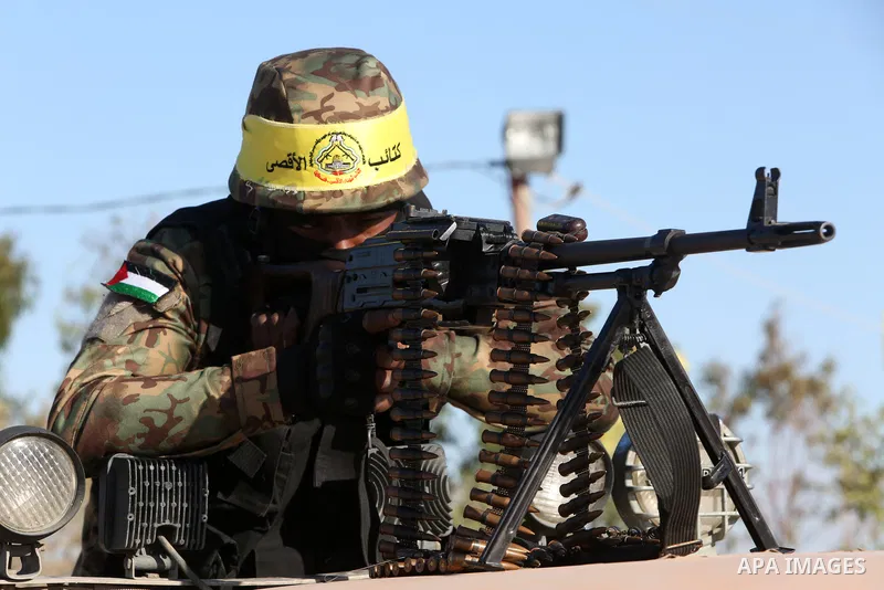Palestinian militants of Al-Aqsa Martyrs' Brigades, the armed wing of Fatah movement take part in a military parade in an anti-Israel rally, in Khan Younis in the southern of Gaza Strip June 7, 2021. Photo by Abed Deeb
