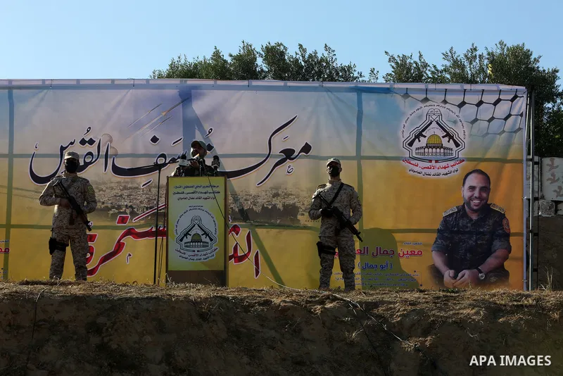 Palestinian militants of Al-Aqsa Martyrs' Brigades, the armed wing of Fatah movement take part in a military parade in an anti-Israel rally, in Khan Younis in the southern of Gaza Strip June 7, 2021. Photo by Abed Deeb