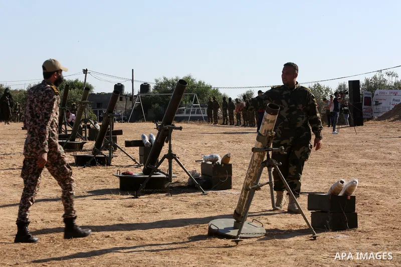 Palestinian militants of Al-Aqsa Martyrs' Brigades, the armed wing of Fatah movement take part in a military parade in an anti-Israel rally, in Khan Younis in the southern of Gaza Strip June 7, 2021. Photo by Abed Deeb