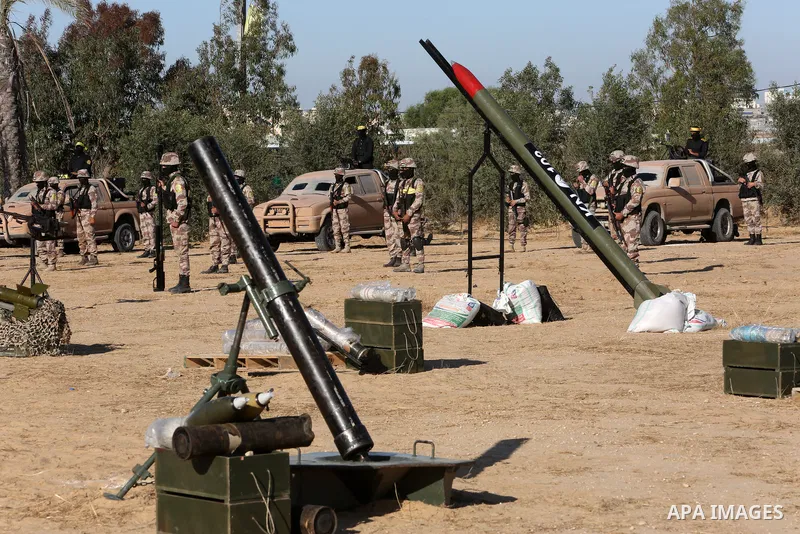 Palestinian militants of Al-Aqsa Martyrs' Brigades, the armed wing of Fatah movement take part in a military parade in an anti-Israel rally, in Khan Younis in the southern of Gaza Strip June 7, 2021. Photo by Abed Deeb
