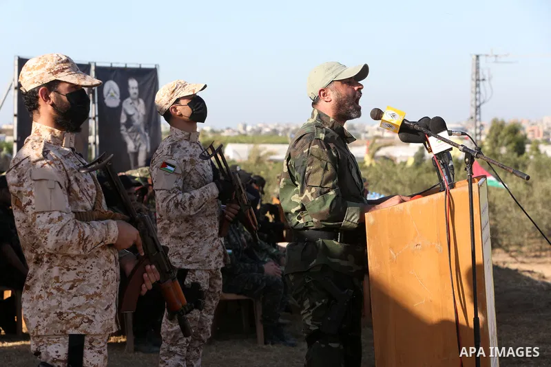 Palestinian militants of Al-Aqsa Martyrs' Brigades, the armed wing of Fatah movement take part in a military parade in an anti-Israel rally, in Khan Younis in the southern of Gaza Strip June 7, 2021. Photo by Abed Deeb