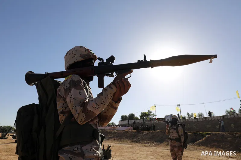 Palestinian militants of Al-Aqsa Martyrs' Brigades, the armed wing of Fatah movement take part in a military parade in an anti-Israel rally, in Khan Younis in the southern of Gaza Strip June 7, 2021. Photo by Abed Deeb