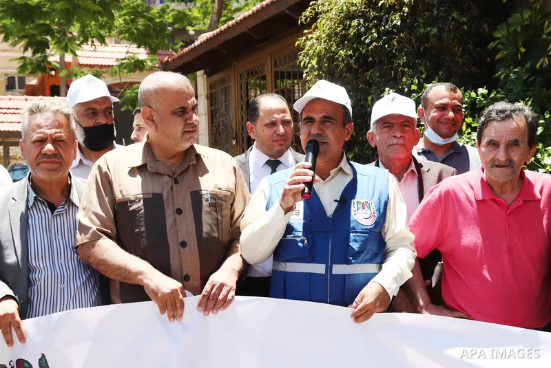 Palestinian journalists take part in the protest against the dismissal of Head of the PJS, Nasser Abu Bakr from his job, in front of the Agence France Press (AFP) office, in Gaza city on June 7, 2021. Abu Bakr, who has w...
