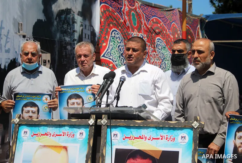 Palestinians take part in a solidarity with leader of Islamic Jihad Khader Adnan, in Gaza city, on June 7, 2021. Political prisoner held by Israel, Khader Adnan, 43, has declared a hunger strike the day he was abducted b...