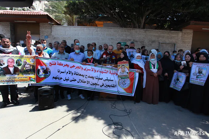 Palestinians take part in a protest to show solidarity with prisoners on Israeli Jails, in front of the headquarters of Red cross, in Gaza City on June 7, 2021. Some 4,650 Palestinian prisoners were being held in the Isr...