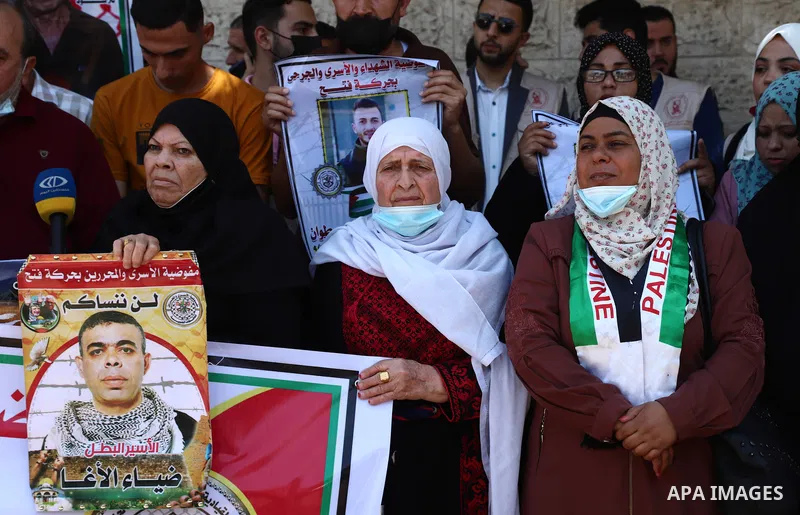 Palestinians take part in a protest to show solidarity with prisoners on Israeli Jails, in front of the headquarters of Red cross, in Gaza City on June 7, 2021. Some 4,650 Palestinian prisoners were being held in the Isr...